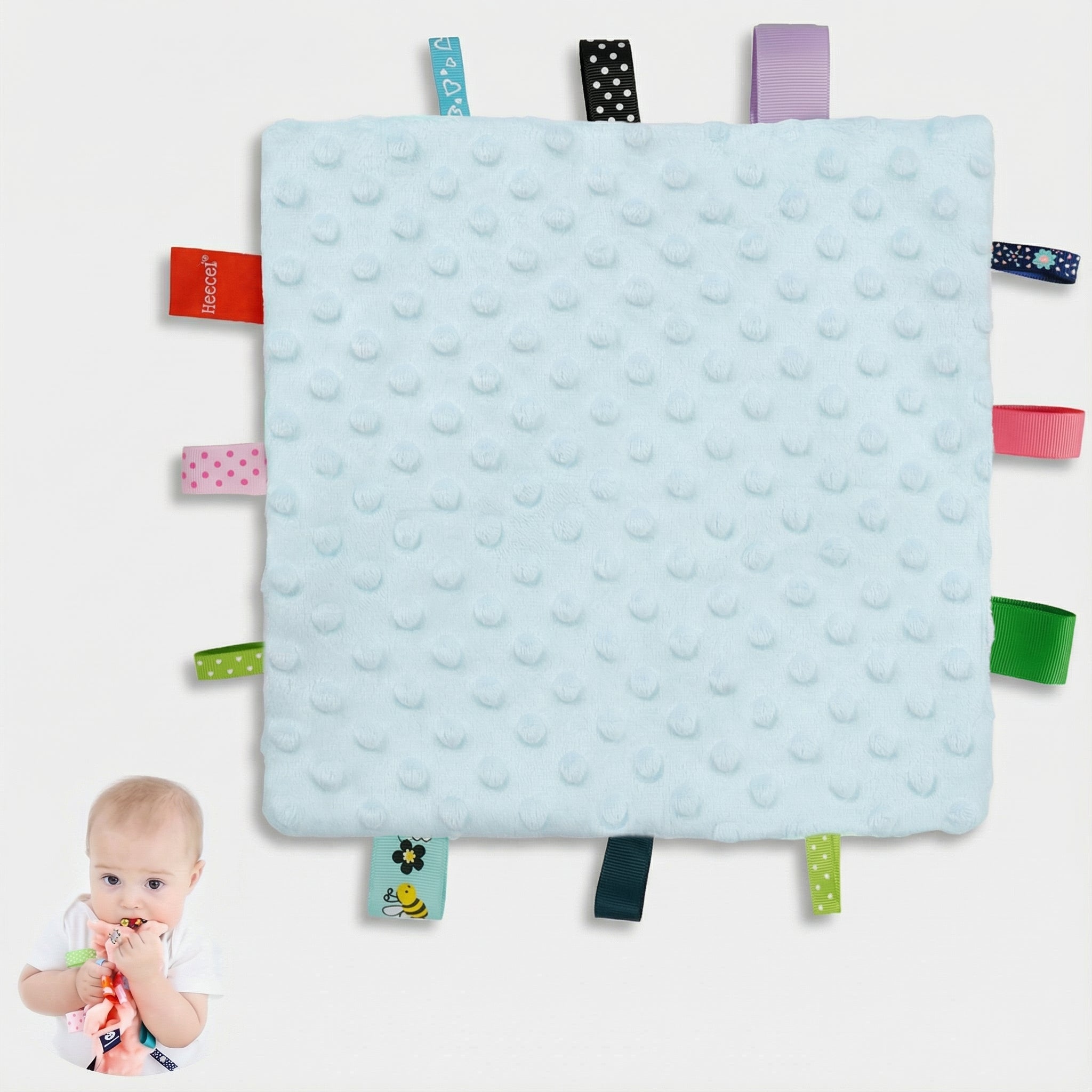 taggie blanket baby blanket with tags all around it
