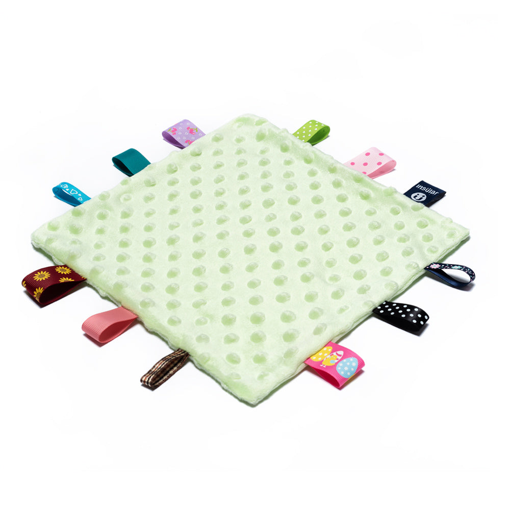 taggie blanket baby blanket with tags all around it